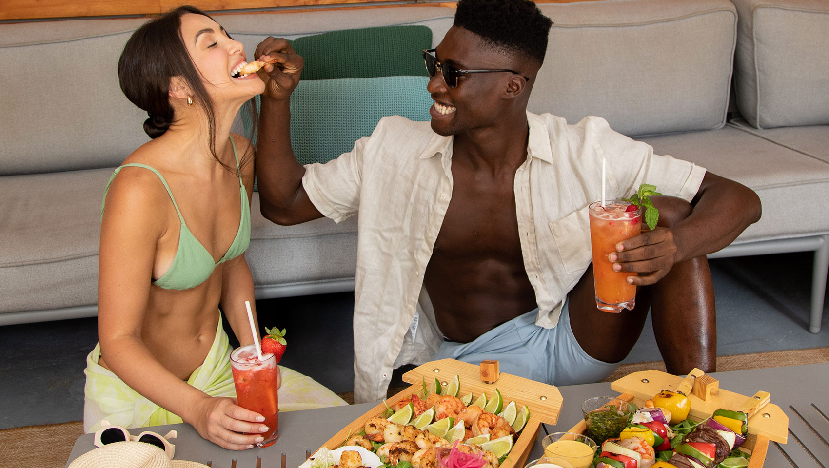 Couple with food in cabana