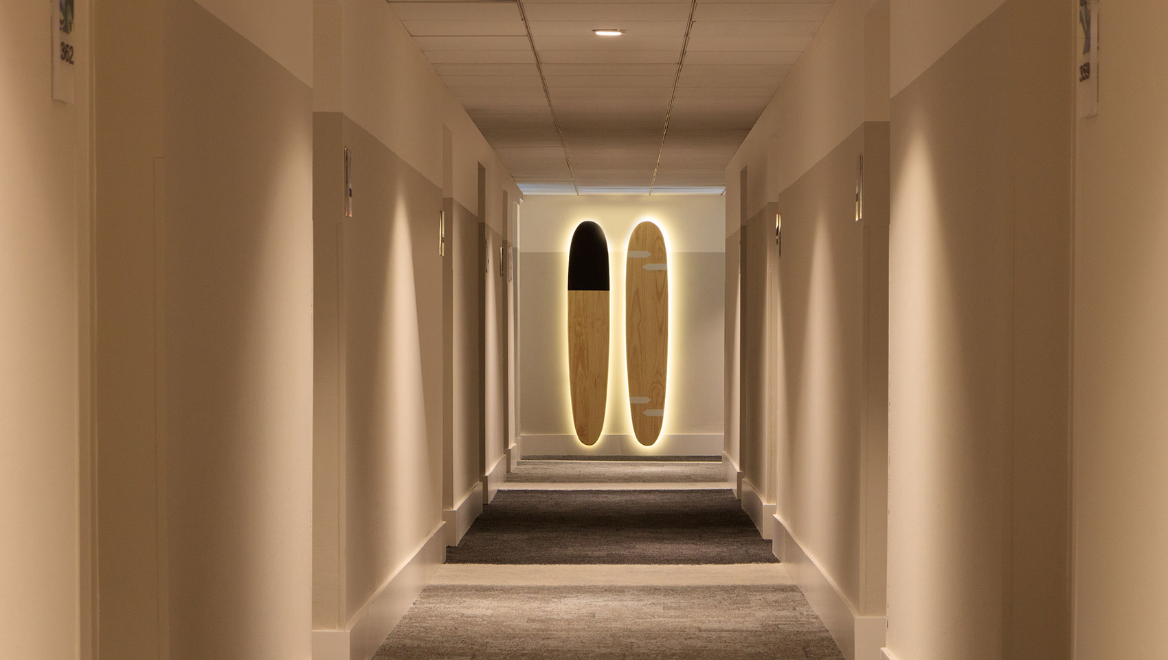 surfboards at the end of a hallway