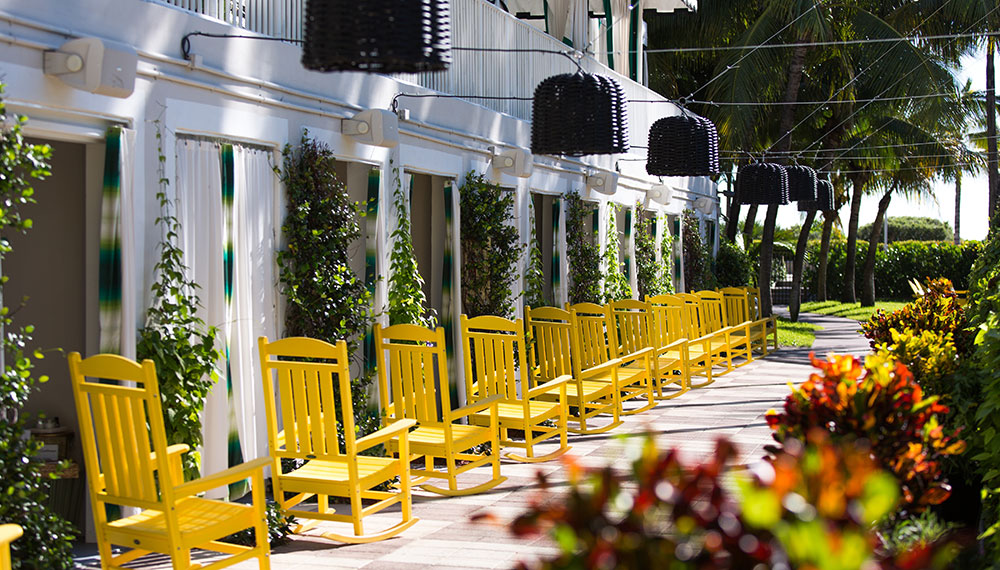 Rocking chairs in front of cabanas at Surfcomber